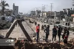 تصاویر بازگشت هزاران فلسطینی به «دیر البَلَح»
