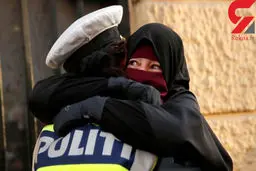 زن باحجاب از ترس مامور پلیس را در آغوش کشید + عکس