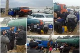 توزیع نفت رایگان میان زلزله‌زدگان در هوای بارانی سرپل‌ ذهاب/عکس