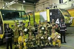 ادای احترام آتش نشانان فرودگاه امام خمینی به همکارانشان در حادثه پلاسکو