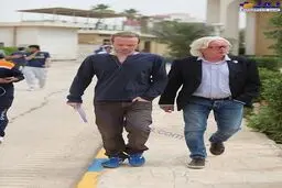 تصویری از سرمربی معروف فوتبال به همراه پسرش