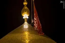 تعویض پرچم گنبد حرم حضرت ابوالفضل(ع)/تصاویر