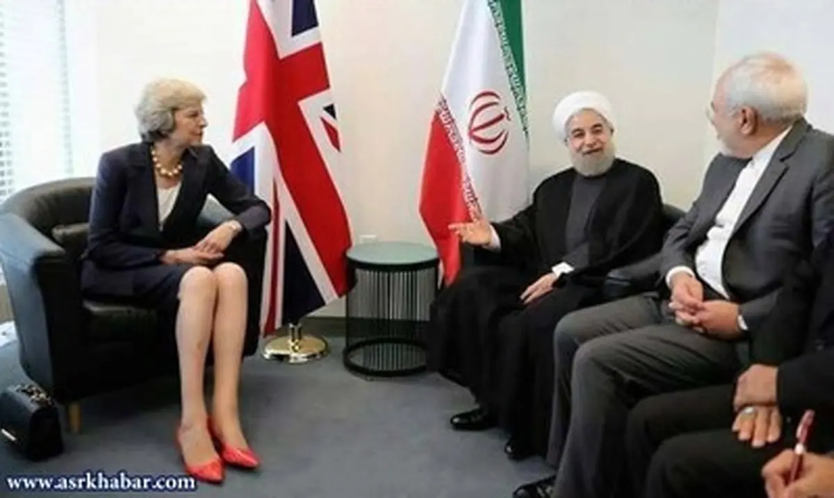 روحانی و ظریف به خاطر عکس با این خانم محروم می شوند؟/عکس