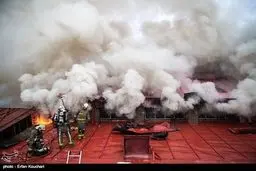 تصاویری از آتش سوزی در انبار فرش تهران