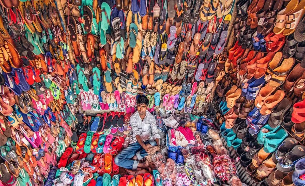 عکس روز نشنال جئوگرافیک از کفش فروش بنگلادشی / عکس