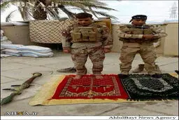 عکس/ نماز دو رزمنده شیعه و سنی