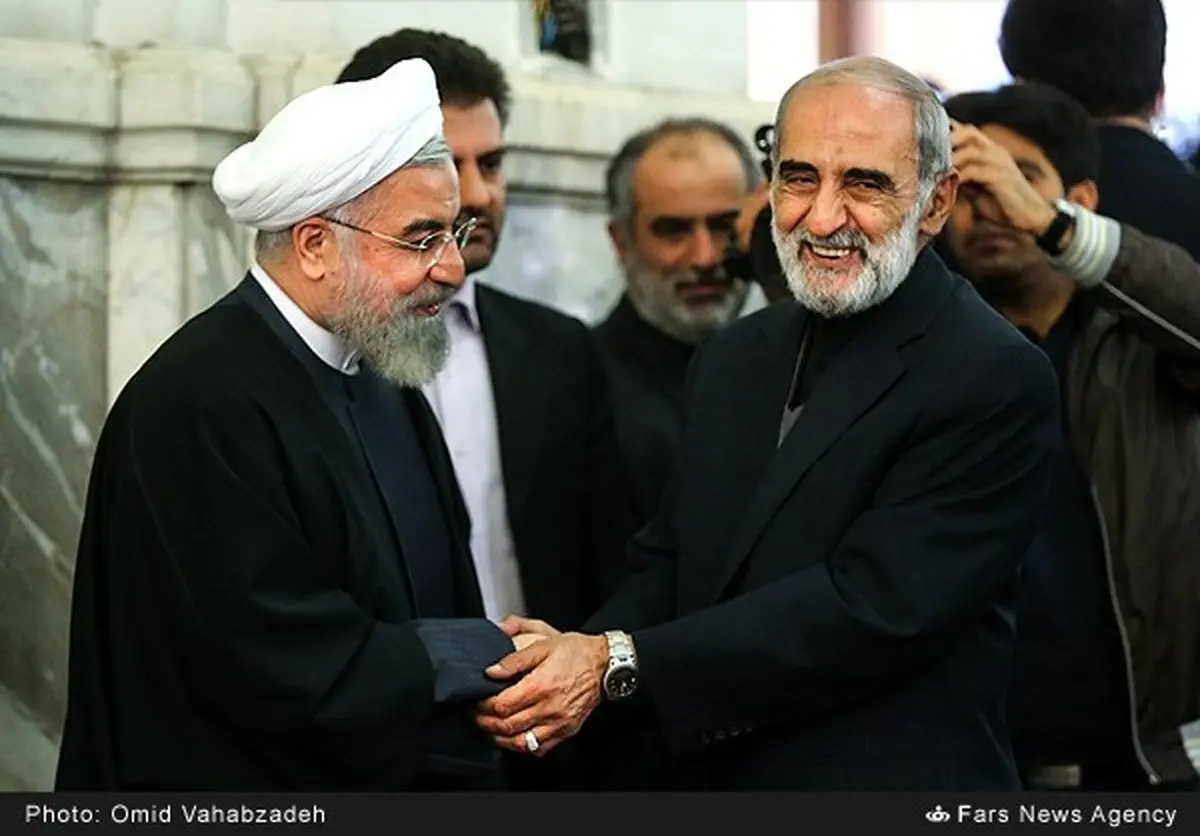 خوش و بش روحانی و حسین شریعتمداری/ عکس