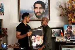 ستاره پرسپولیس به خانه شهید مدافع حرم رفت/ تصاویر