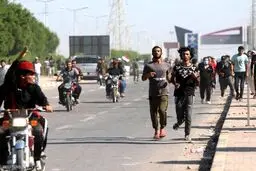 تظاهرات جدید در بغداد و تلاش نیروهای امنیتی برای متفرق کردن تظاهرکنندگان + عکس