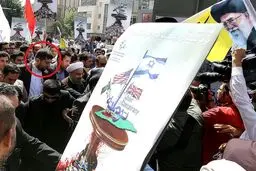 محافظ شخصی حسن نصرالله بادیگارد روحانی شد؟/ عکس