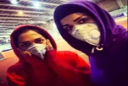 تصویری از تمرین بانوان دوومیدانی با ماسک روی صورت