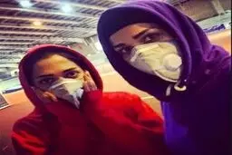 تصویری از تمرین بانوان دوومیدانی با ماسک روی صورت