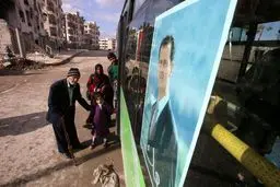 تصویر بشار اسد روی اتوبوس های سوریه/عکس