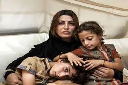 عکس دردناک یک مادر آواره عراقی